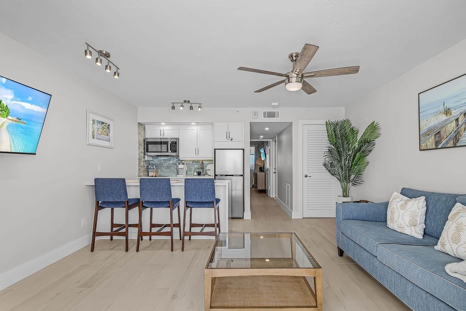 Beautifully remodeled space with custom island & plenty of comfortable seating