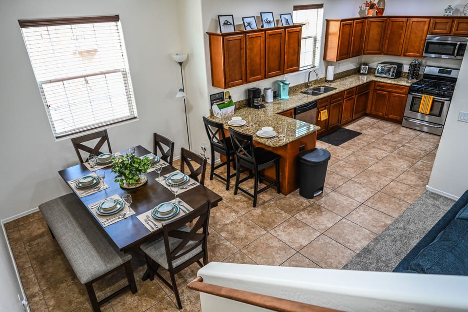 Stair view of Kitchen and Dining area. 
