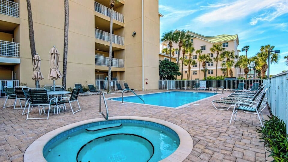 Emerald Dunes has a large pool (heated seasonally) and hot tub with plenty of lounge seating! 