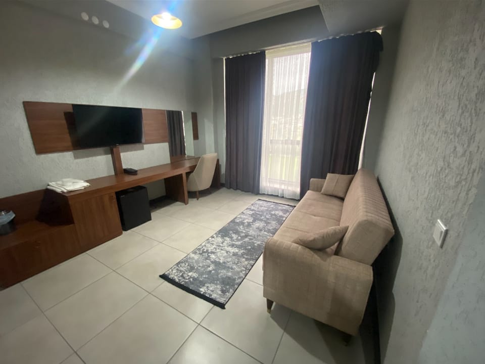 Family Room with Balcony, River View | Living area
