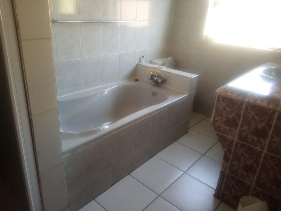 Separate tub and shower, towels, soap, shampoo