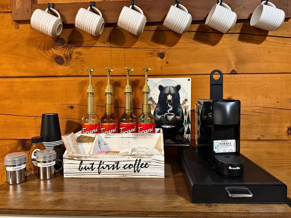 Start slow at the stocked coffee bar — Keurig, Nespresso, mugs and a spread of options so your first cup is exactly how you like it.