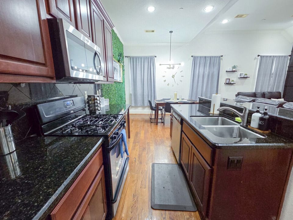 Fully equipped kitchen with stainless steel appliances, ample cabinet space, and a dedicated coffee station to start your mornings right.