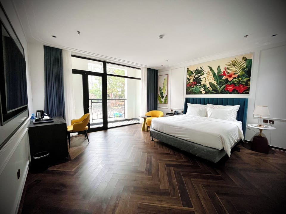 Deluxe Double or Twin Room, Balcony, Garden View | Desk, laptop workspace, blackout drapes, iron/ironing board