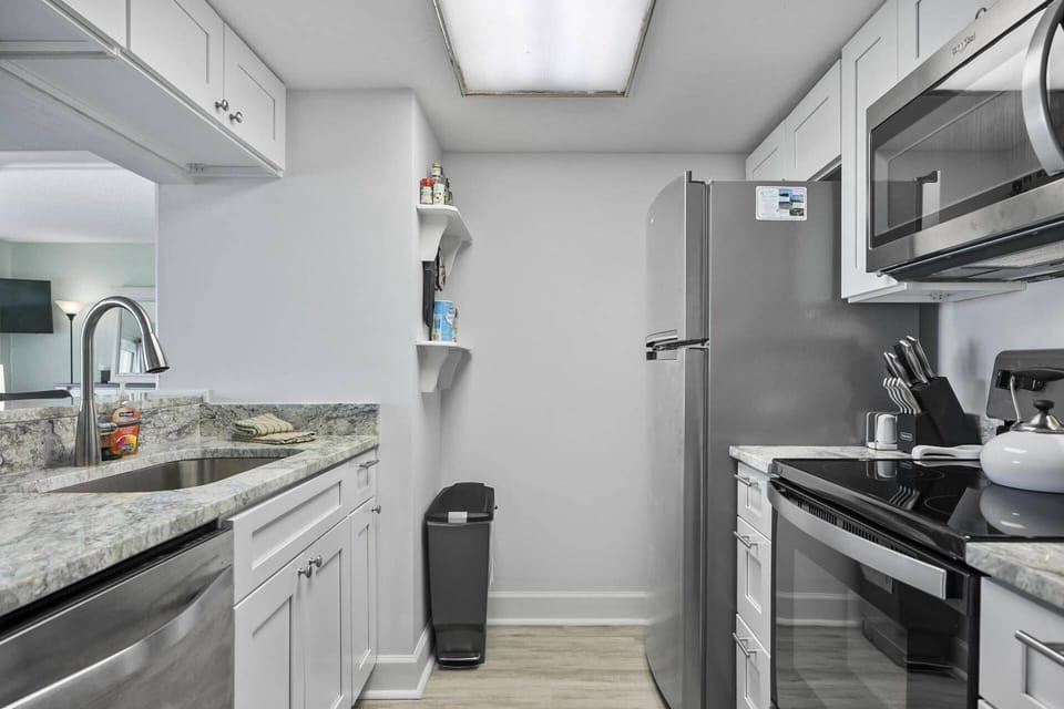 Enjoy cooking is this beautifully renovated kitchen with modern finishes, seamlessly integrated into the open-concept living space.