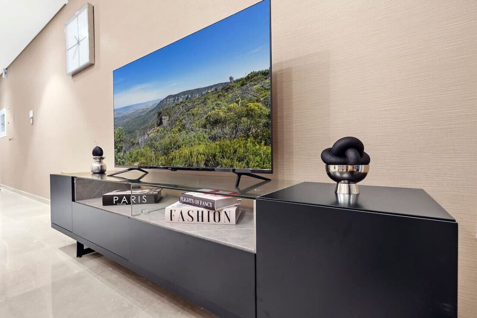 Living Room: Stylish entertainment hub with a stunning view and sleek décor awaits your relaxation!
