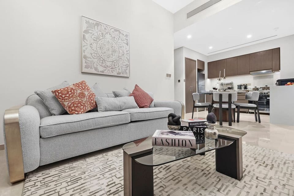 Living Room: Stylish space to unwind with modern decor and a view of culinary delights!