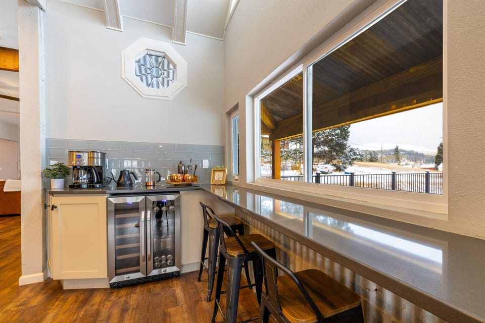 The breakfast bar overlooks the deck and mountains. It's a great place to have coffee with a laptop if you just have to get some work done!