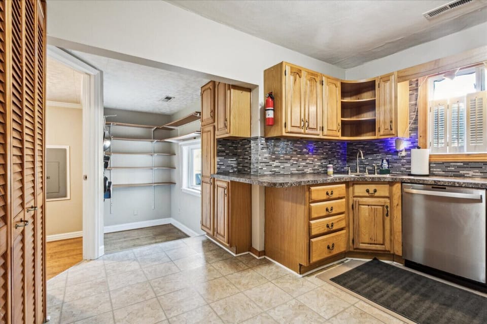 There is a ton of storage attached to this kitchen - with two different pantries.