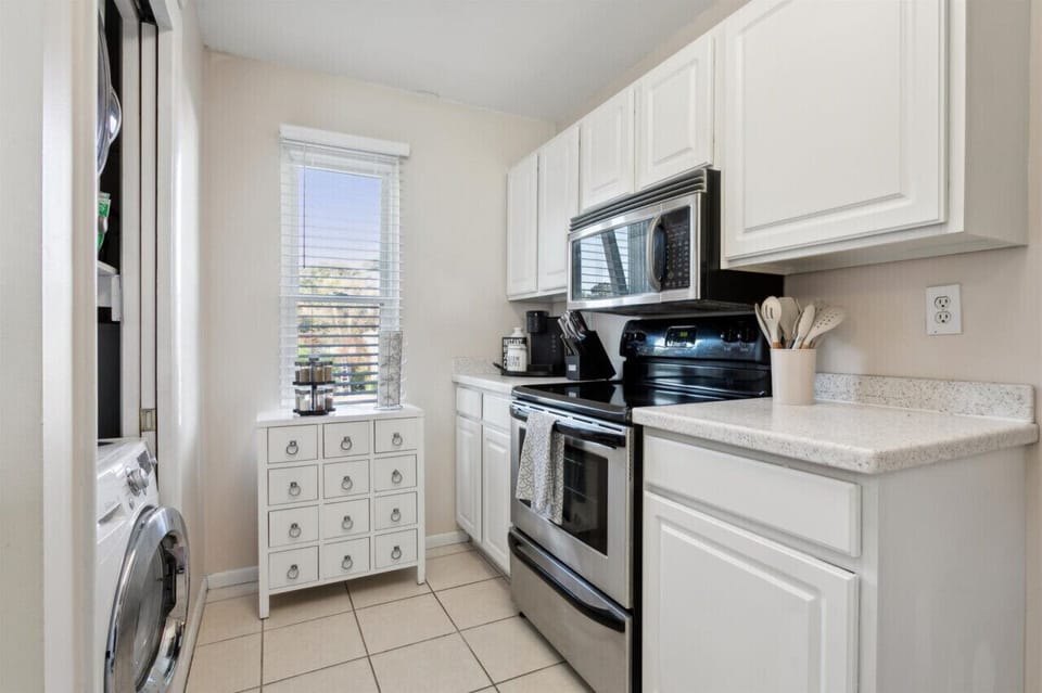 This kitchen has everything you need - cooking, meal prep, and storage.