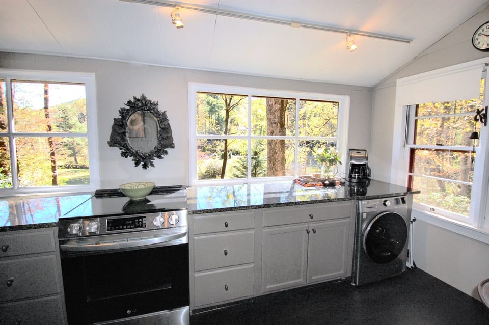 Kitchen, with range and washer dryer combo unit