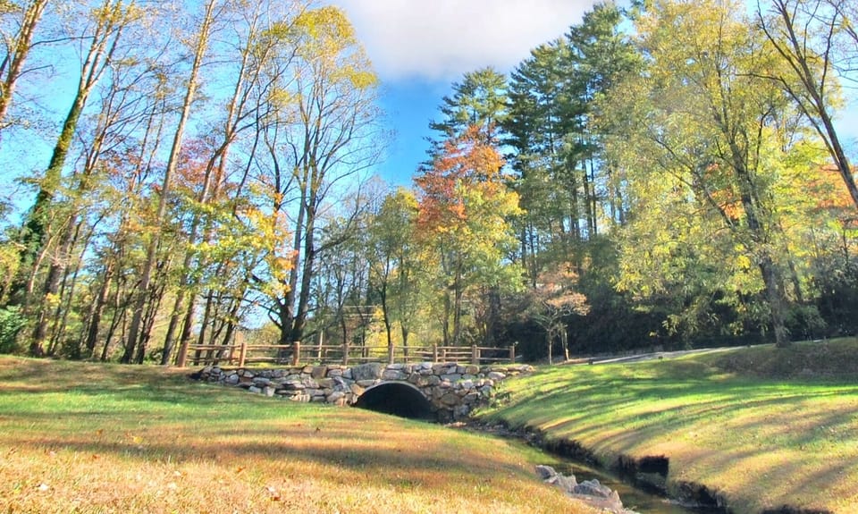 Beautiful stone bridge that you will drive over adds to the enchantment and provides the ideal photo backdrop