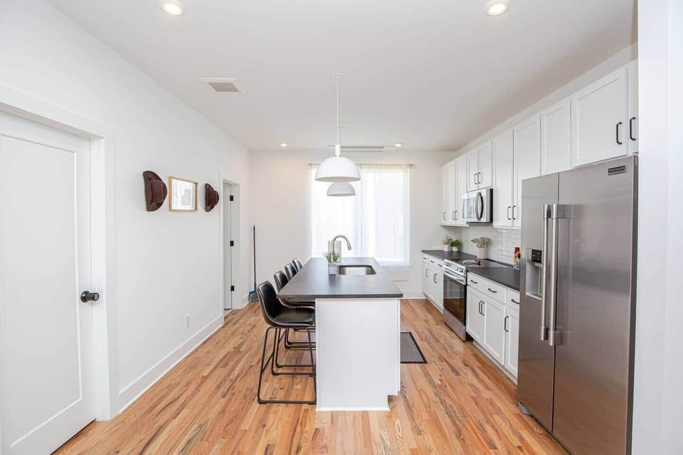 Full kitchen with island and all of the amenities needed to cook at home! 