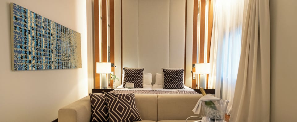 Premium bedding, down comforters, memory foam beds, minibar