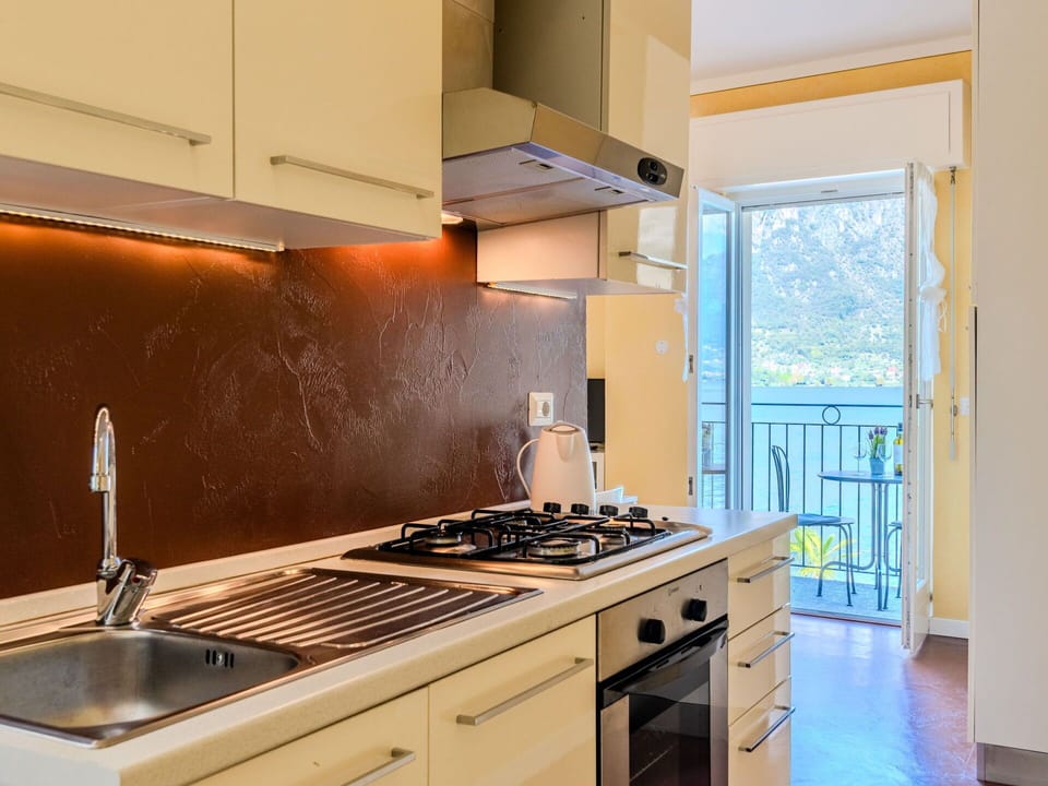 Cabinetry, Countertop, Kitchen Appliance, Kitchen Stove, Gas Stove, Kitchen Sink, Cooktop, Building, Kitchen, Home Appliance