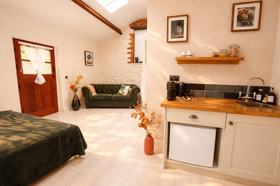 kitchenette, sofa, and bed
