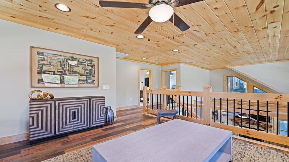 Stylish loft space with modern artwork, wood accents, and beautiful views.