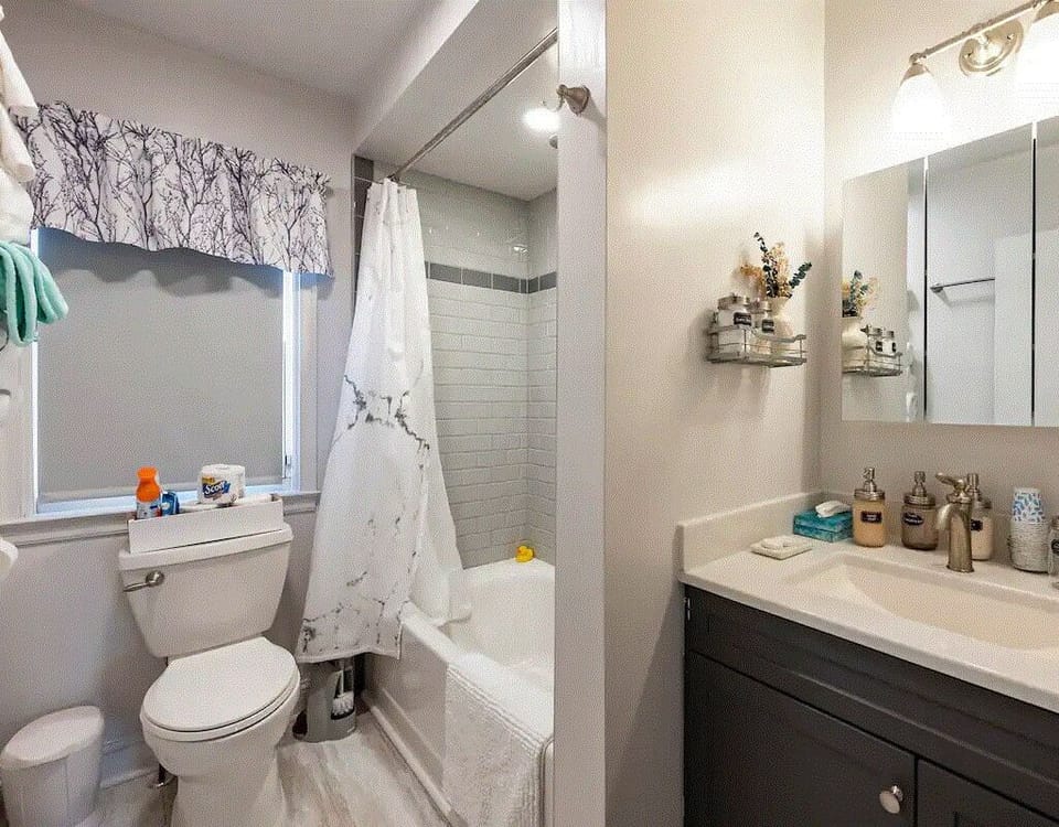 Main bath has a tub with a shower.