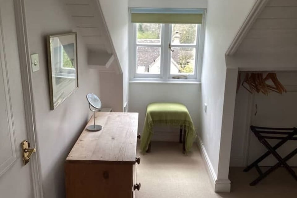 Pine dresser ands window overlooking the garden in the double bedroom