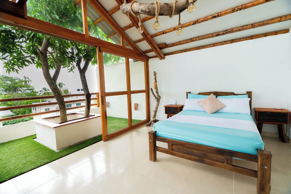 Deluxe Suite, Private Bathroom, Beach View | Desk, laptop workspace, soundproofing, WiFi (free)
