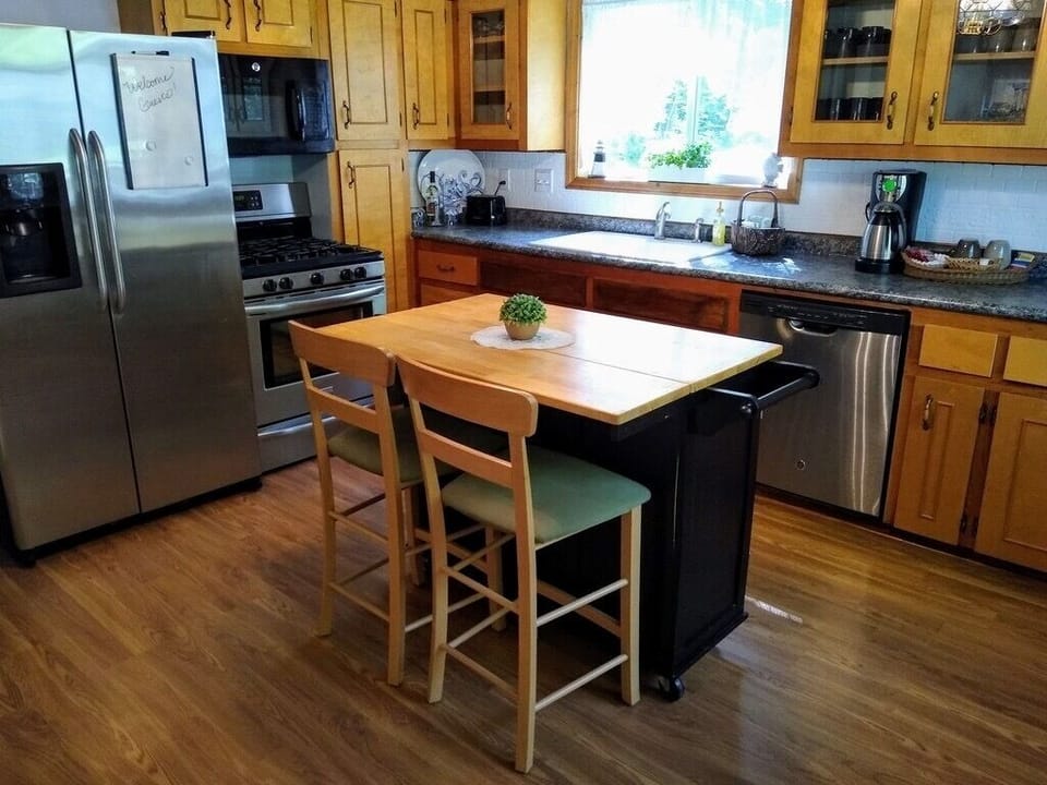 Fully furnished kitchen with dishwasher, microwave, coffee maker, and more!