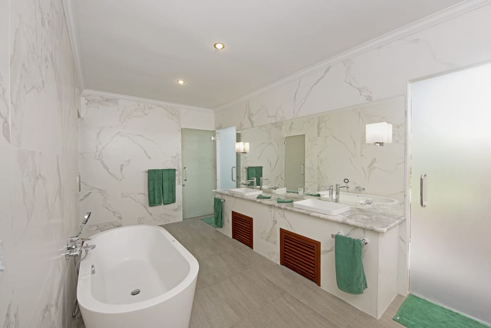 Superior Bungalow, Ocean View, Overwater | Bathroom | Separate tub and shower, rainfall showerhead, free toiletries