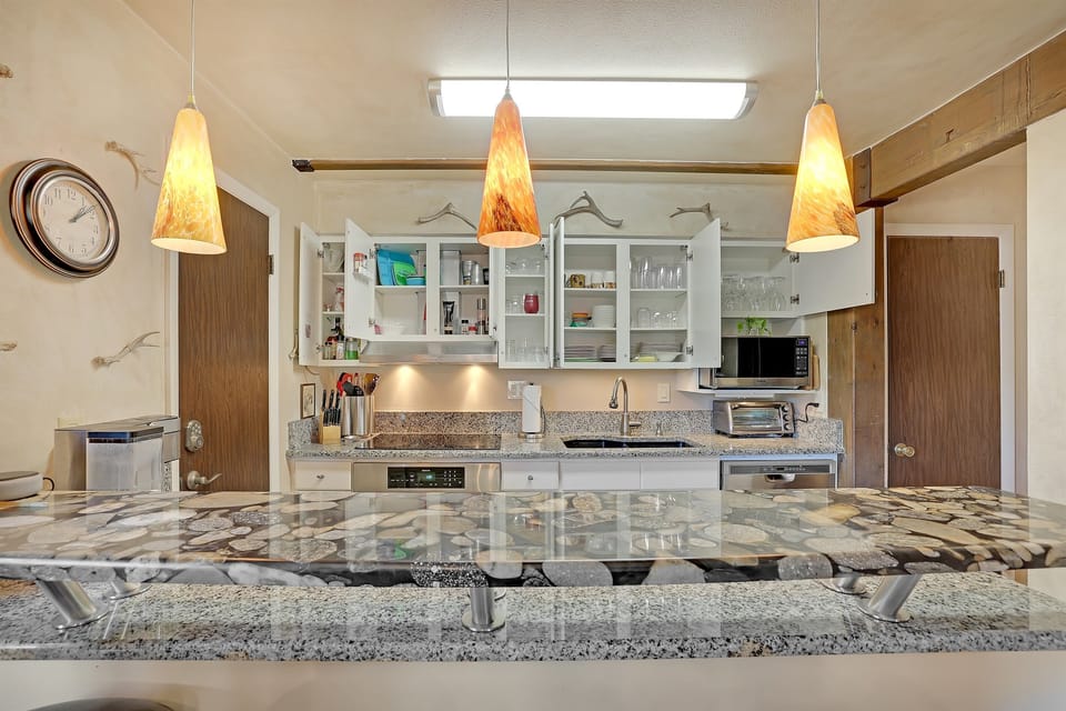 Fully equipped kitchen stocked with cookware, dishes, and essentials for your group.