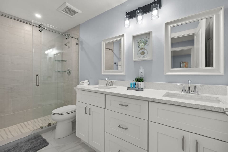 Master ensuite bathroom with double vanity and shower