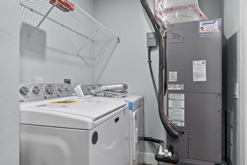 Private laundry area featuring washer and dryer for extended stays.