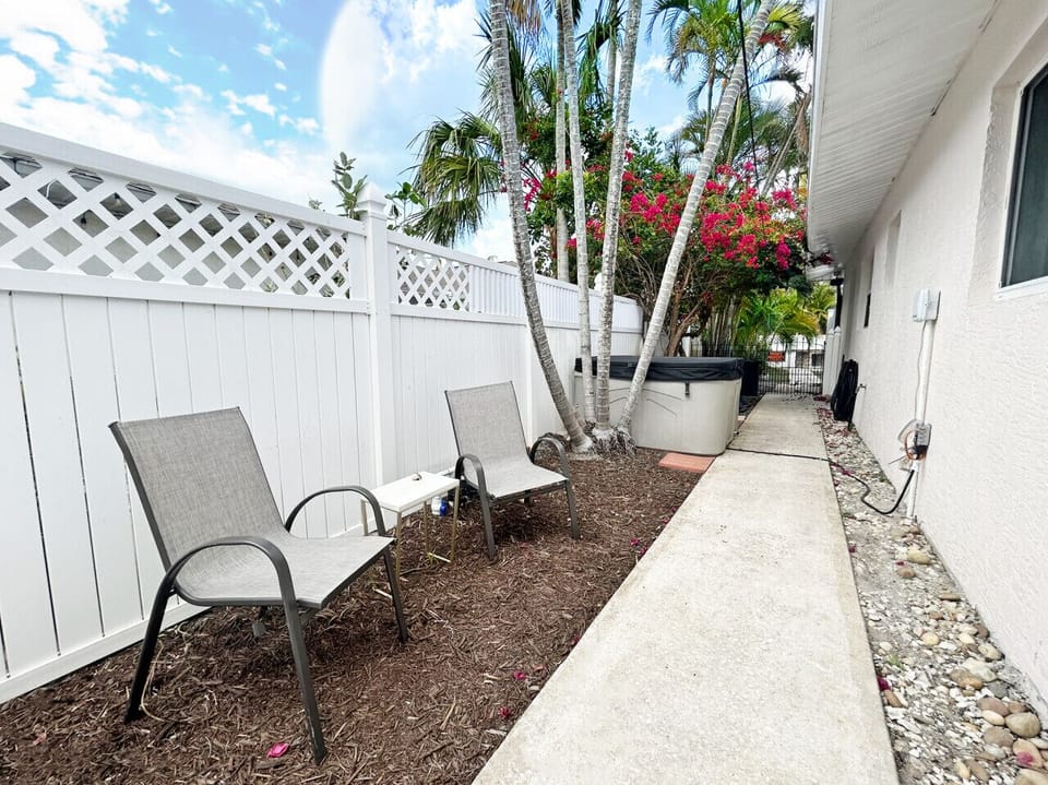 Secluded outdoor terrace offering comfortable seating for peaceful relaxation nearby.