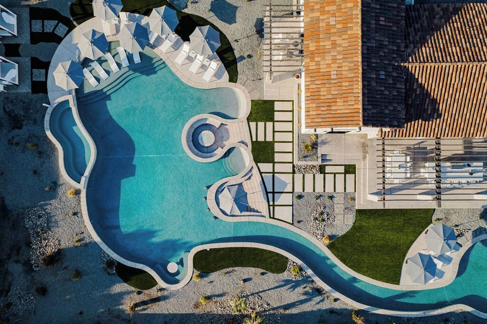 Outdoor paradise featuring an expansive lazy river that winds across the entire property.