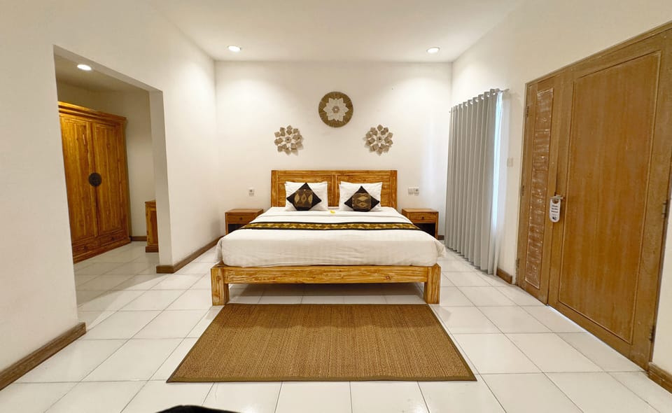 Deluxe Double Room, Balcony, Garden View | In-room safe, desk, laptop workspace, blackout drapes