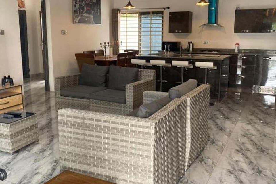 View from the seating area to watch TV and entertainment with the American style kitchen indoor.