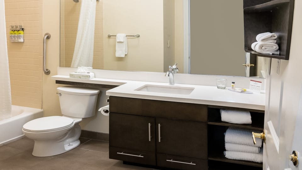 Suite, 1 Bedroom | Bathroom | Combined shower/tub, hair dryer, towels
