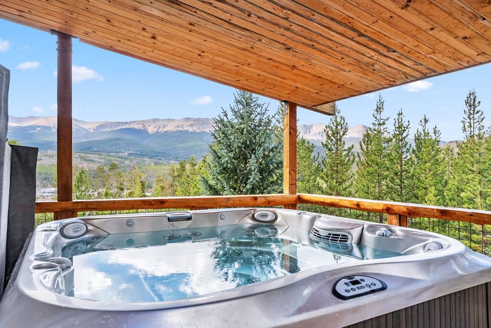 Exterior: 8-person hot tub, outdoor seating, lower deck
