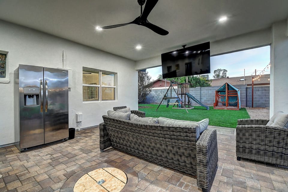 Outdoor living area w/75" TV and 3rd Fridge