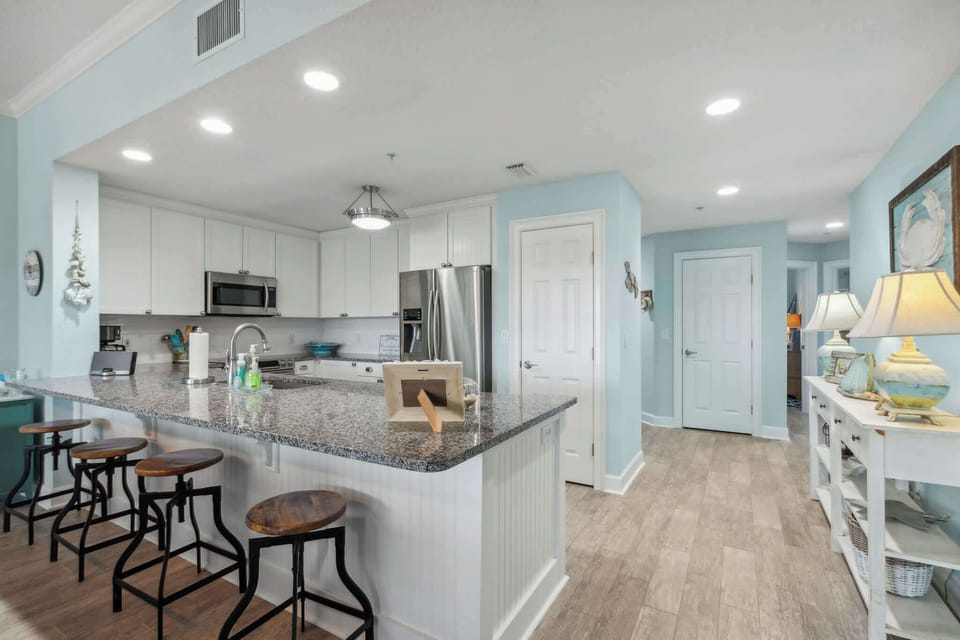 Bar seats 4, two bedrooms and bathroom are down the hallway pictured 