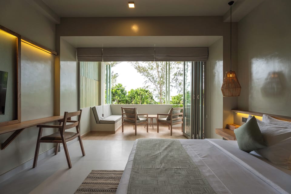 Deluxe Room 5, Ocean View | Minibar, in-room safe, desk, laptop workspace