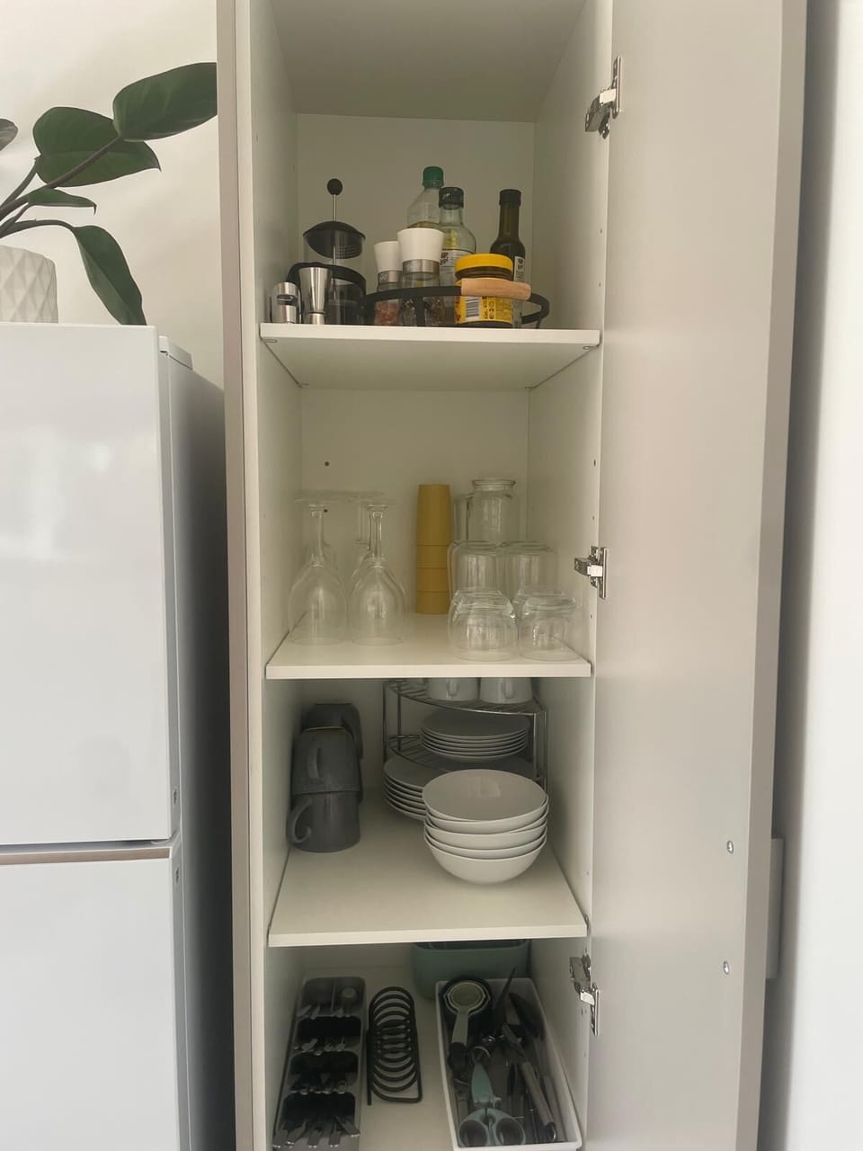 Well stocked pantry with cups, glasses & dinnerware. Basic condiments provided