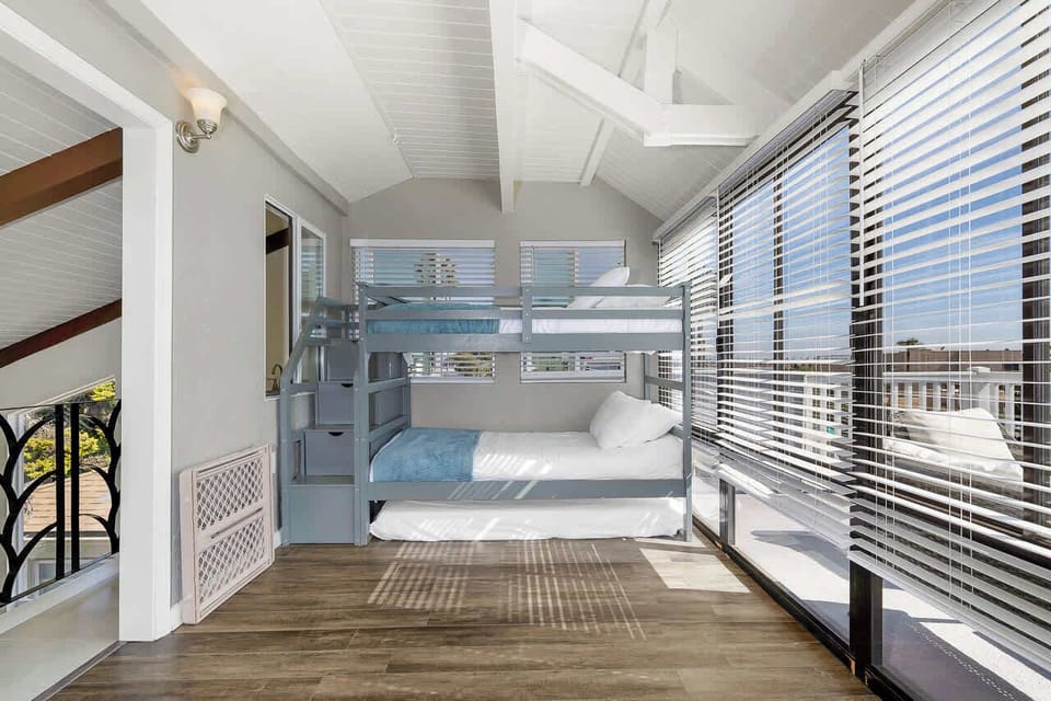 3rd level loft with bunk beds. Sleeps 2. Access from living room spiral stair case