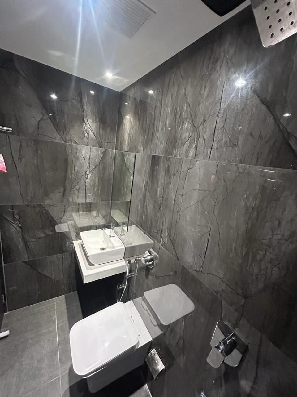 Shower, rainfall showerhead, towels, soap