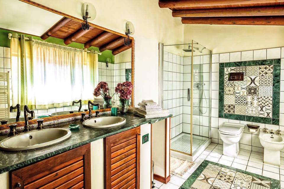 Deluxe Suite, 2 Bedrooms, Ensuite, Sea View | Bathroom | Shower, rainfall showerhead, hair dryer, towels