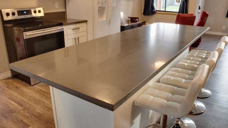 "Quartz countertops with barstools"