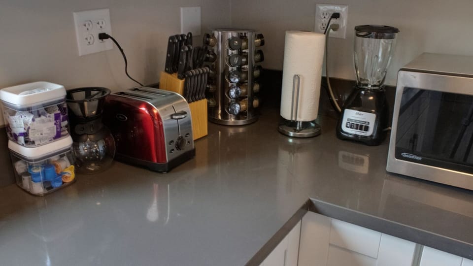 "A fully stocked kitchen with coffee"