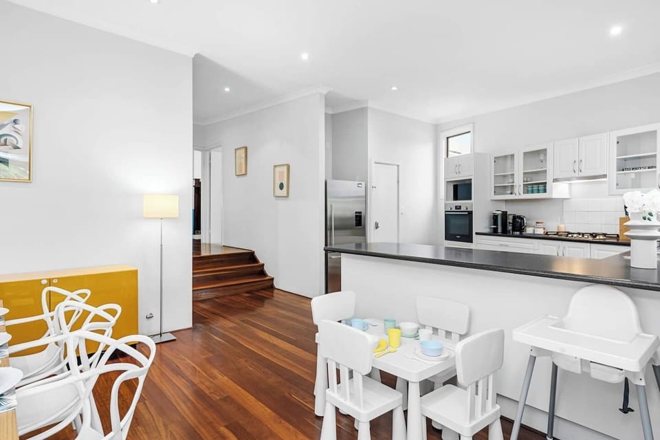 Open-plan living with kitchen view.