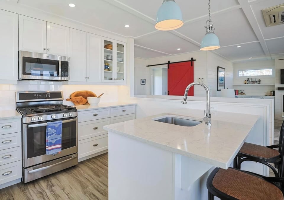 Kitchen includes all dinnerware and cookware with many small appliances.