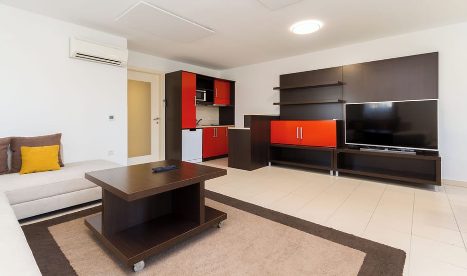 Family Apartment, 2 Bedrooms, Garden View | Living area | Flat-screen TV