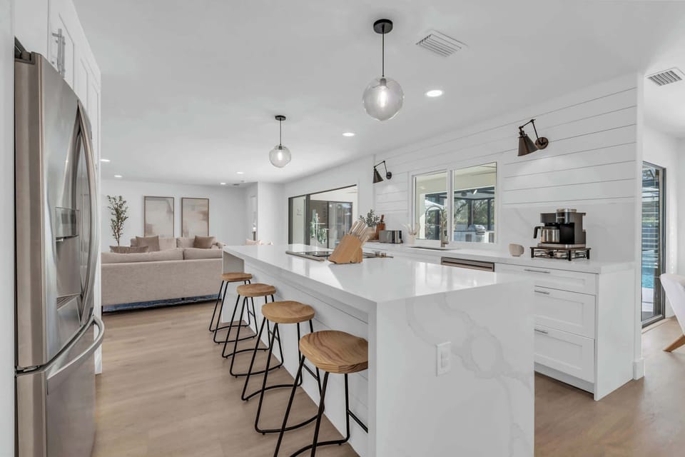 Another view of the kitchen which has been completely remodeled and has a suite of stainless steel appliances. 