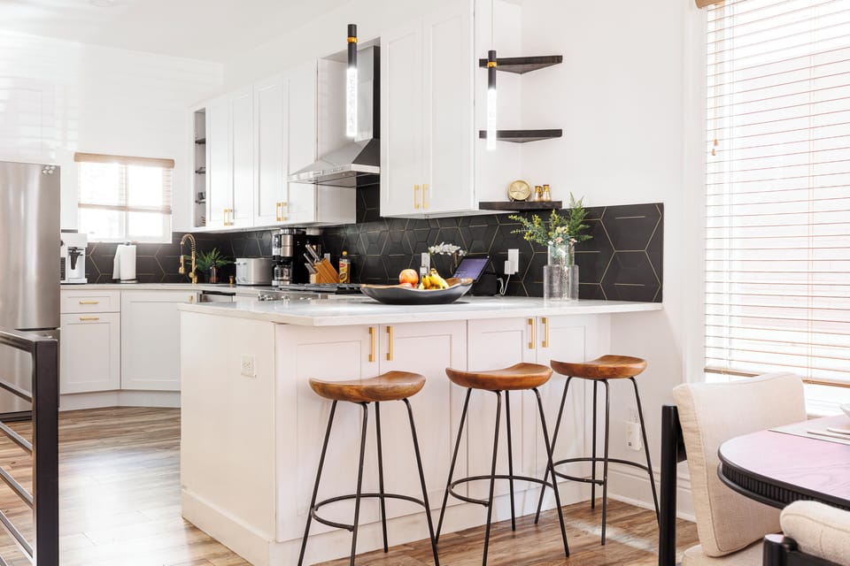 Open kitchen / dining concept with peninsula for eating, working, or gathering 