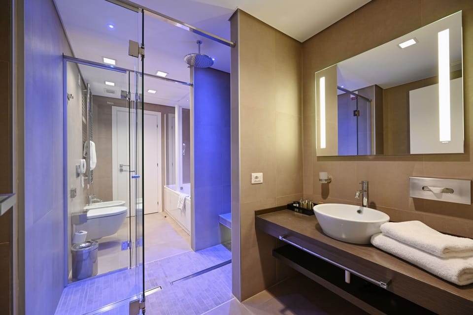 Suite, 1 Bedroom | Bathroom | Separate tub and shower, free toiletries, hair dryer, bathrobes